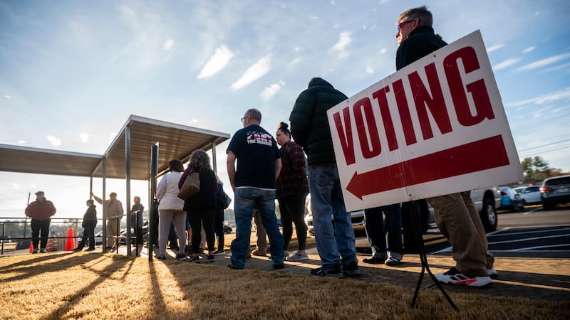 People are seen in line to vote at the sole polling place open for Saturday early voting in Bartow County.
