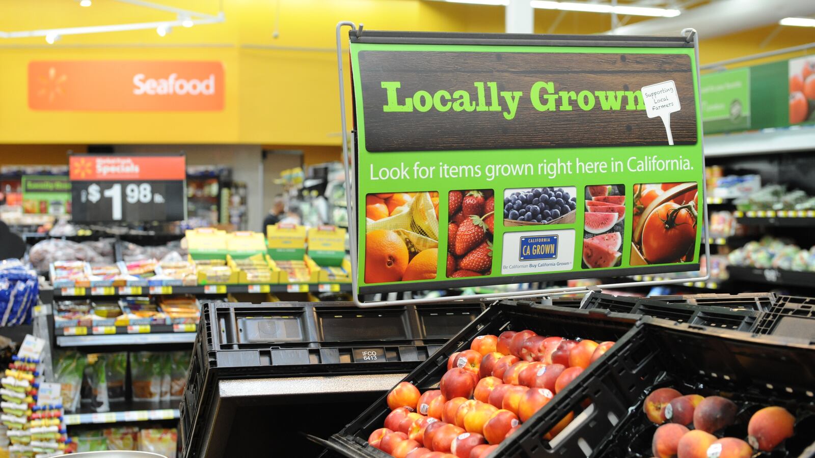 Consumers shop for fruit products for sale at Walmart store, June 1, 2012 in Rosemead, California.