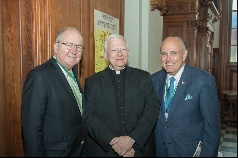 Rudy Giuliani, right, with his longtime adviser Peter Powers, left, who died in 2016, and a priest.