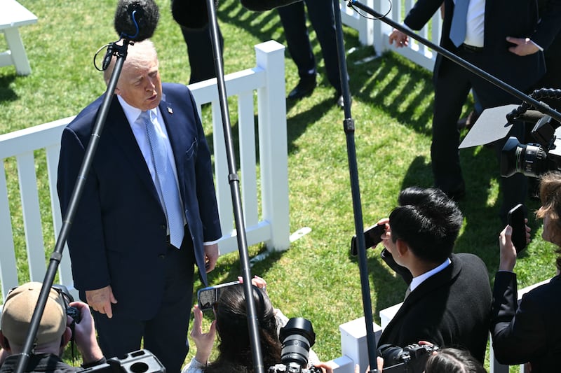 US President Donald Trump speaks to members of the media as he hosts the annual Easter Egg Roll on the South Lawn of the White House on April 6, 2026, in Washington, DC. (Photo by SAUL LOEB / AFP via Getty Images)