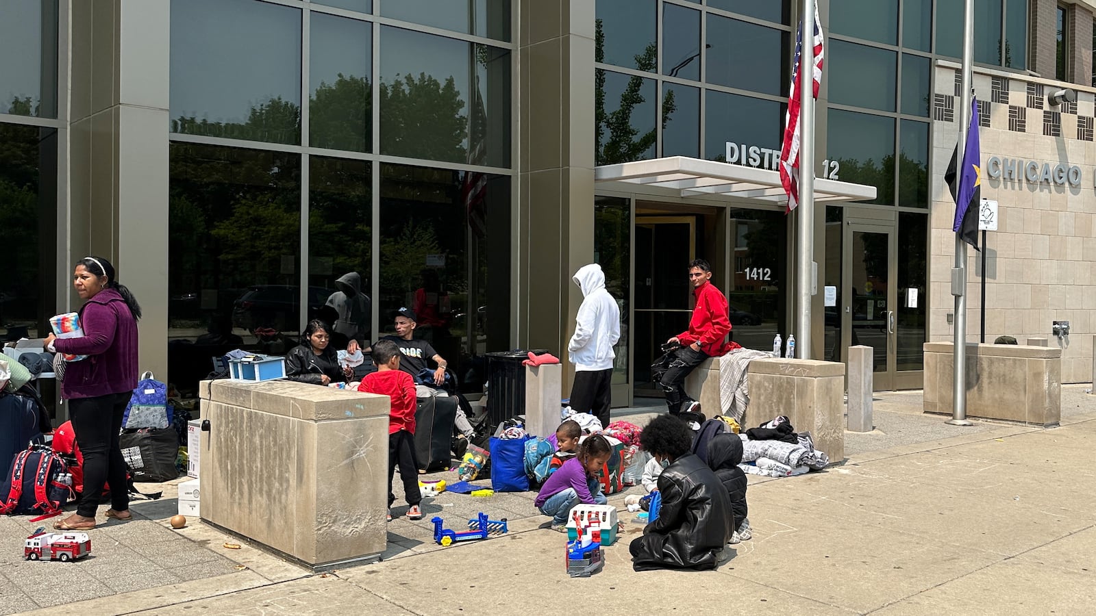 Migrants, without a place to stay upon arrival in the city, seek safe shelter at the District 12 station of the Chicago Police Department