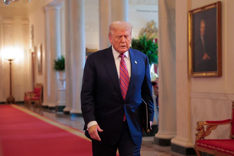 President Donald Trump arrives for a signing ceremony for the GENIUS Act at the White House on July 18, 2025 where he spoke about how a "smart president" would never let the dollar slide.