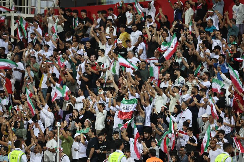 Iran supporters celebrate a goal during the 2026 FIFA World Cup AFC qualifiers group A football match between Iran and Qatar at the Rashid Stadium in Dubai  (Photo by Fadel Senna / AFP) (Photo by