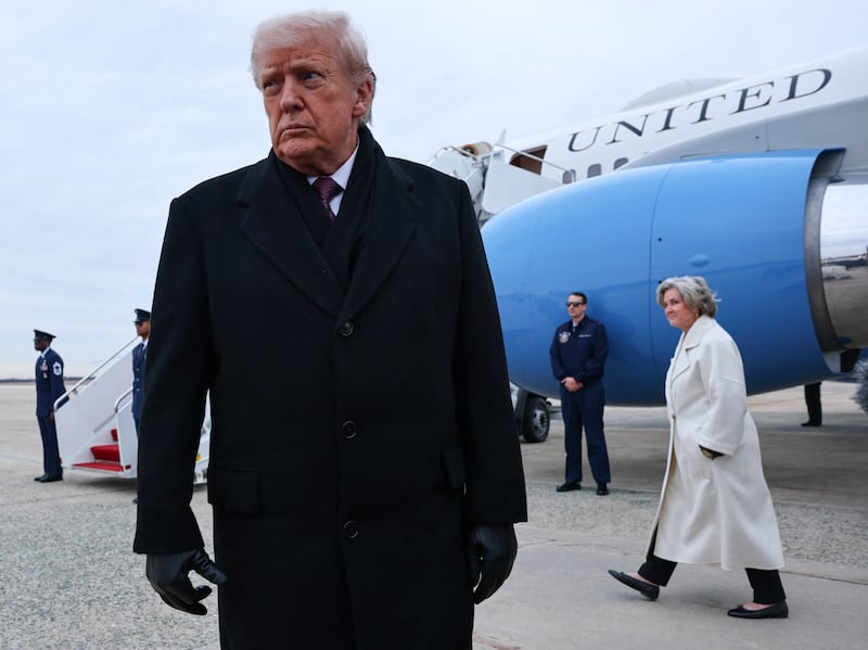 White House Chief of Staff Susie Wiles walks as U.S. President Donald Trump speaks with reporters, after he disembarked Air Force One on his return from Dover, Delaware, at Joint Base Andrews, Maryland, U.S., December 17, 2025. REUTERS/Jonathan Ernst