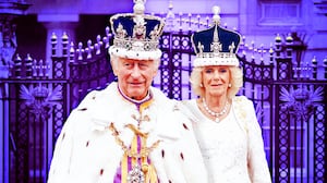 A photo illo illustration of King Charles, Camilla, and the gates of Buckingham Palace.
