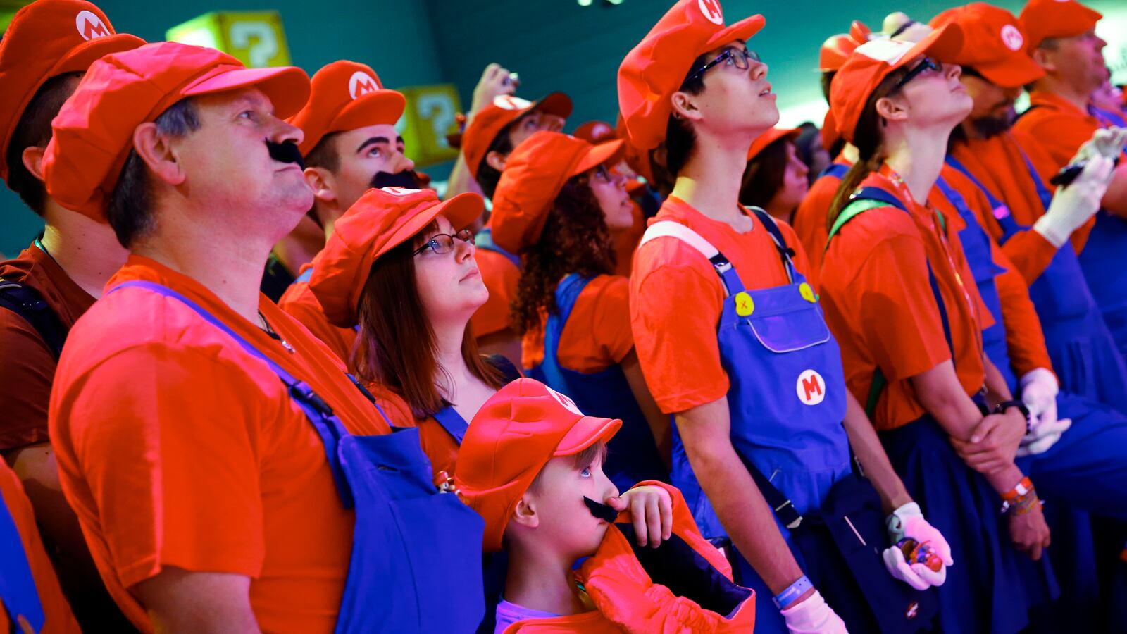 Cosplayers dressed as Mario