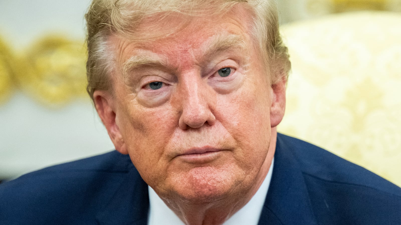 President Donald Trump looks on during a meeting in the Oval Office of the White House in Washington, DC, on August 17, 2026.