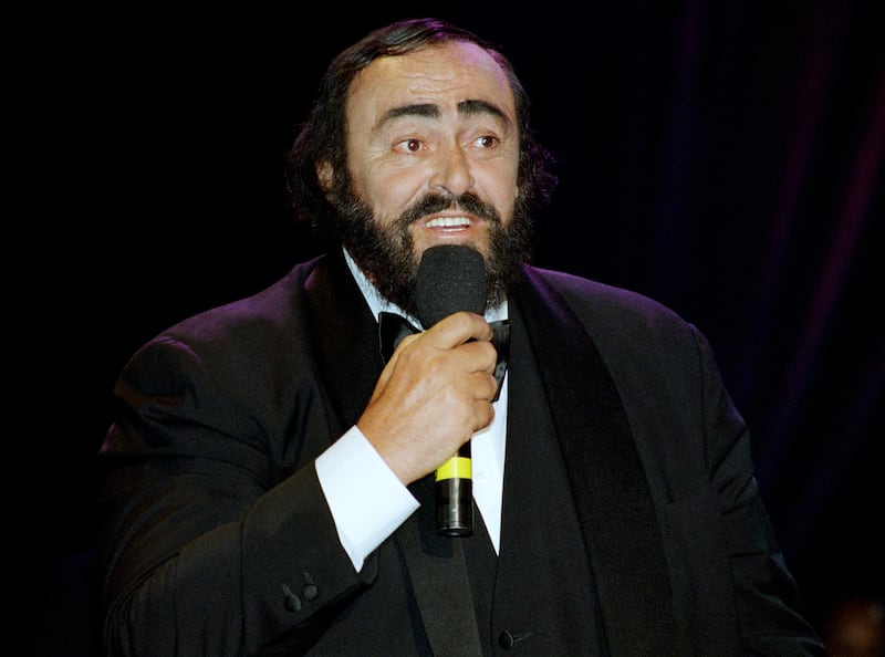 Italian operatic tenor Luciano Pavarotti speaks at the 1998 MusiCares benefit dinner on February 23, 1998 in New York.