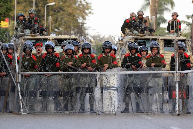articles/2012/05/30/in-egypt-security-agencies-still-major-barriers-to-change/egypt-military-police-khalil_chy2ry