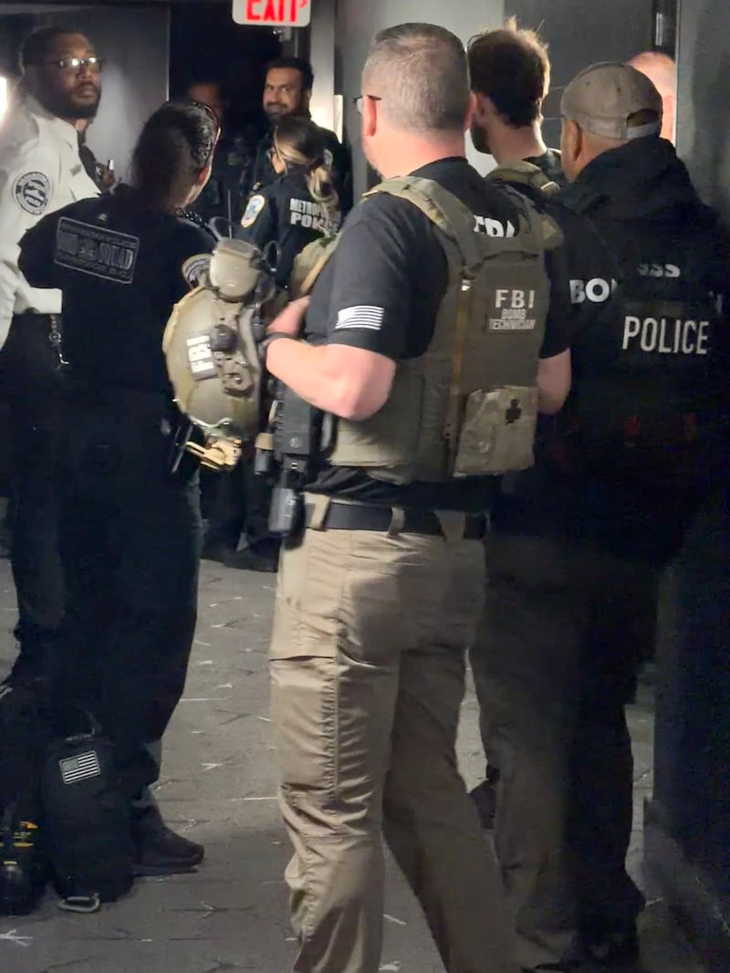 A group of uniformed men in a corridor
