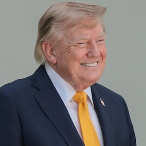 U.S. President Donald Trump stands next to U.S. Secretary of Education Linda McMahon, while hosting a back-to-school-themed event to highlight his administration's education policies, in the Rose Garden at the White House in Washington, D.C., U.S., August 24, 2026.