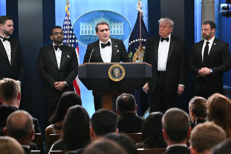 US President Donald Trump, US Vice President JD Vance, FBI Director Kash Patel and US Secretary of Homeland Security Markwayne Mullin listen as Acting Attorney General Todd Blanche speaks during a press briefing in the Brady Briefing Room at the White House in Washington, DC, shortly after a shooting incident at the White House Correspondents' Dinner on April 25, 2026. US President Donald Trump said April 25 he would give a press conference from the White House press briefing room, shortly after a shooting incident at a gala dinner in Washington.