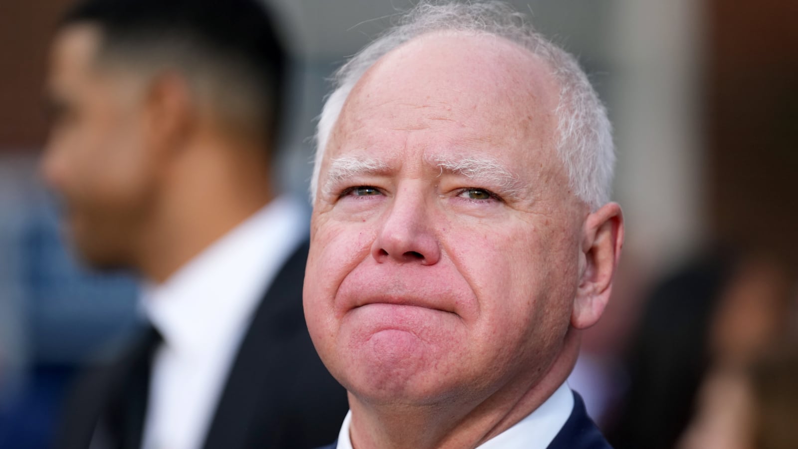 WASHINGTON, DC - NOVEMBER 06: Democratic vice presidential nominee, Minnesota Gov. Tim Walz listens as Democratic presidential nominee, U.S. Vice President Kamala Harris concedes the election during a speech at Howard University on November 06, 2024 in Washington, DC. After a contentious campaign focused on key battleground states, the Republican presidential nominee, former U.S. President Donald Trump was projected to secure the majority of electoral votes, giving him a second term as U.S. President. Republicans also secured control of the Senate for the first time in four years. (Photo by Andrew Harnik/Getty Images)