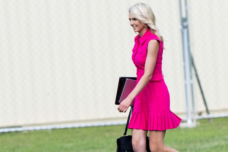 White House aide Natalie Harp walks on the Ellipse near the White House in Washington, DC, August 28, 2026, after arriving on Marine One with the US president.