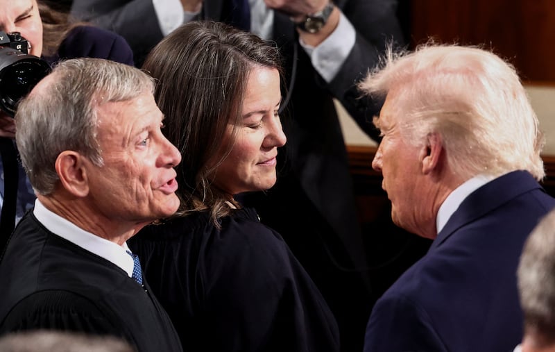 Trump speaks with Supreme Court Chief Justice John Roberts before the State of the Union address last month. He will see him again on Wednesday.