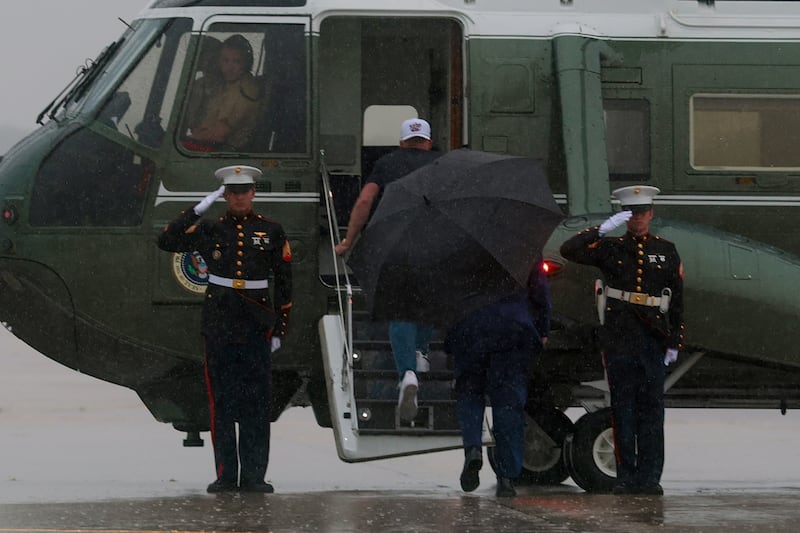 Sports analyst Pat McAfee (2nd-L) boards Marine One with U.S. President Donald Trump (C) as Trump arrives at the Cleveland Hopkins International Airport on August 11, 2026 in Cleveland, Ohio. President Trump is traveling to Ohio to attend the 2026 Patriot Games.
