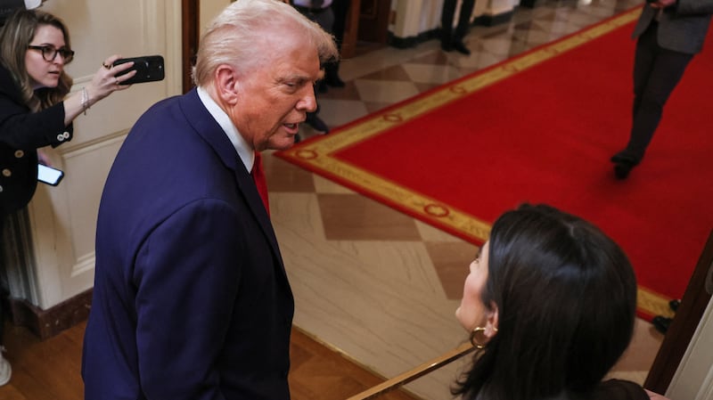 Kaitlan Collins talking to Donald Trump: Probably not smiling.