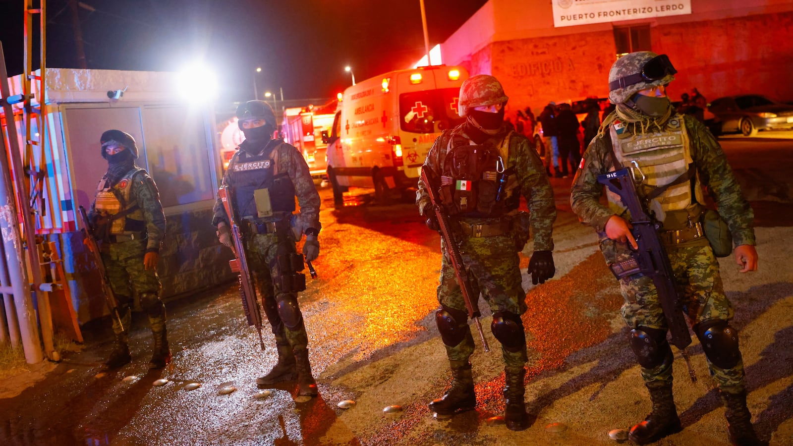 Soldiers keep watch at the entrance of a migrant detention center, after a fire broke out leaving several casualties, in Ciudad Juarez, Mexico March 27, 2023.