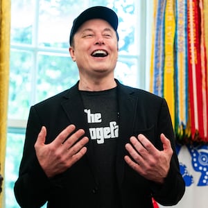 Elon Musk speaks during a news conference with US President Donald Trump