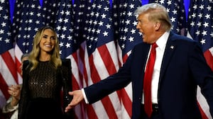 WEST PALM BEACH, FLORIDA - NOVEMBER 06: Republican presidential nominee, former U.S. President Donald Trump reacts on stage with Lara Trump (L) and former first lady Melania Trump (R) during an election night event at the Palm Beach Convention Center on November 06, 2024 in West Palm Beach, Florida. Americans cast their ballots today in the presidential race between Republican nominee former President Donald Trump and Vice President Kamala Harris, as well as multiple state elections that will determine the balance of power in Congress. (Photo by Chip Somodevilla/Getty Images)