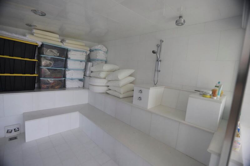 Storage containers sit inside a tile bathroom at Jeffrey Epstein’s Caribbean estate.