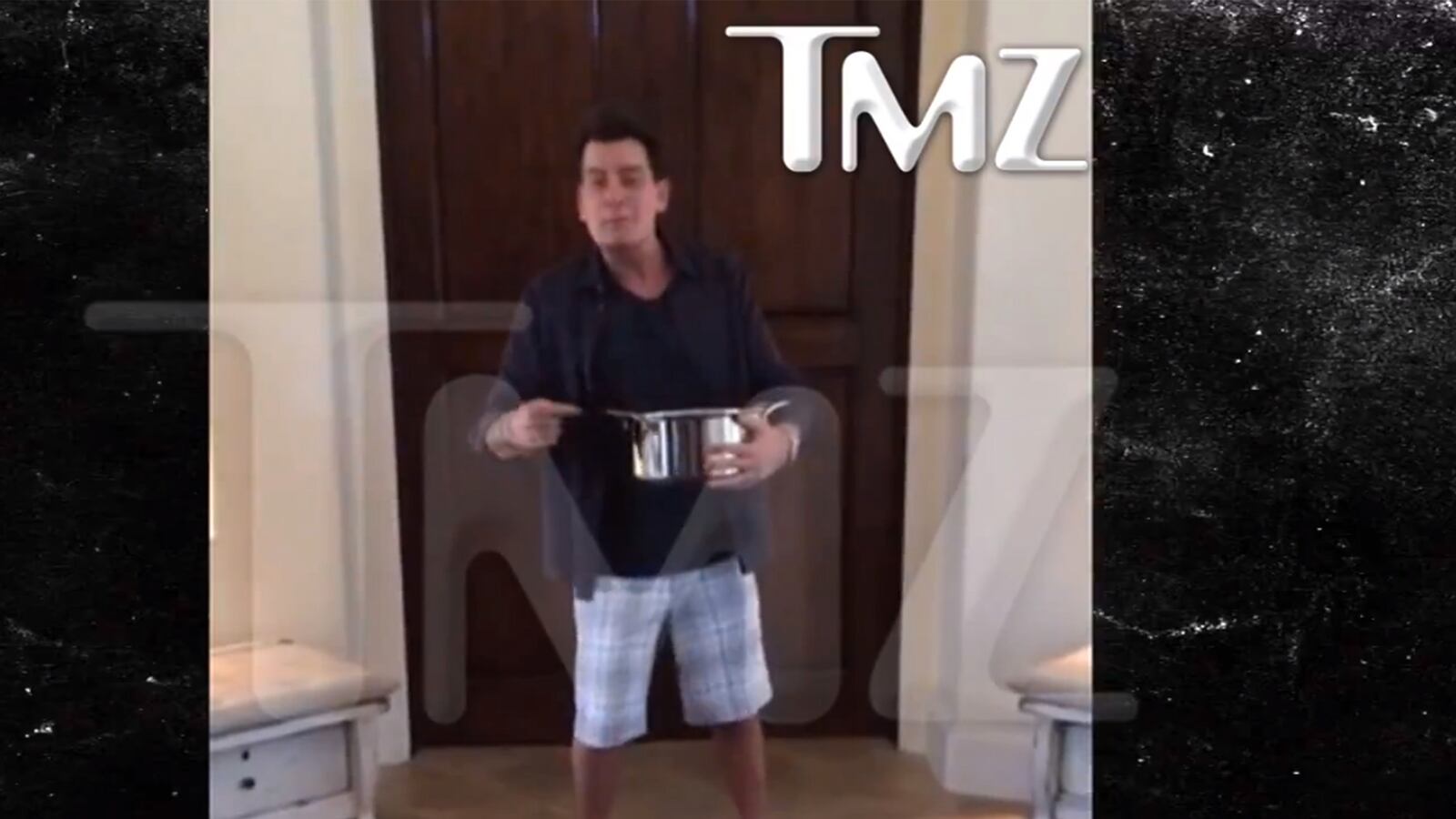 articles/2014/08/19/viral-video-of-the-day-charlie-sheen-does-the-ice-bucket-challenge/140819-viralvid-sheen-tease_ttp6wn