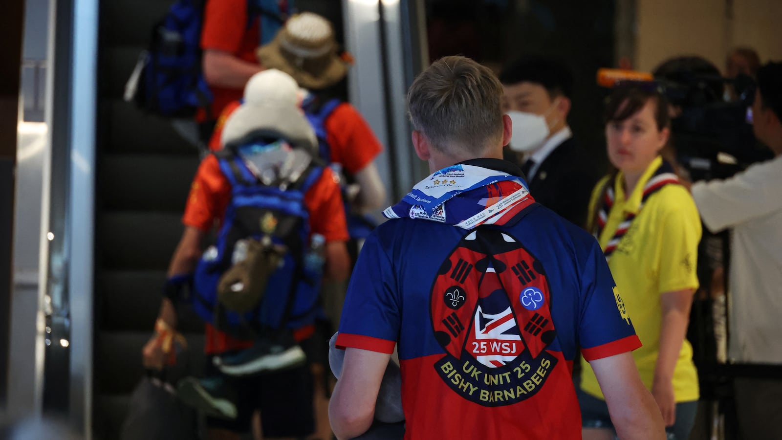 British participants who left a camping site of the 25th World Scout Jamboree arrive at a hotel in Seoul, South Korea, Aug. 5, 2023.