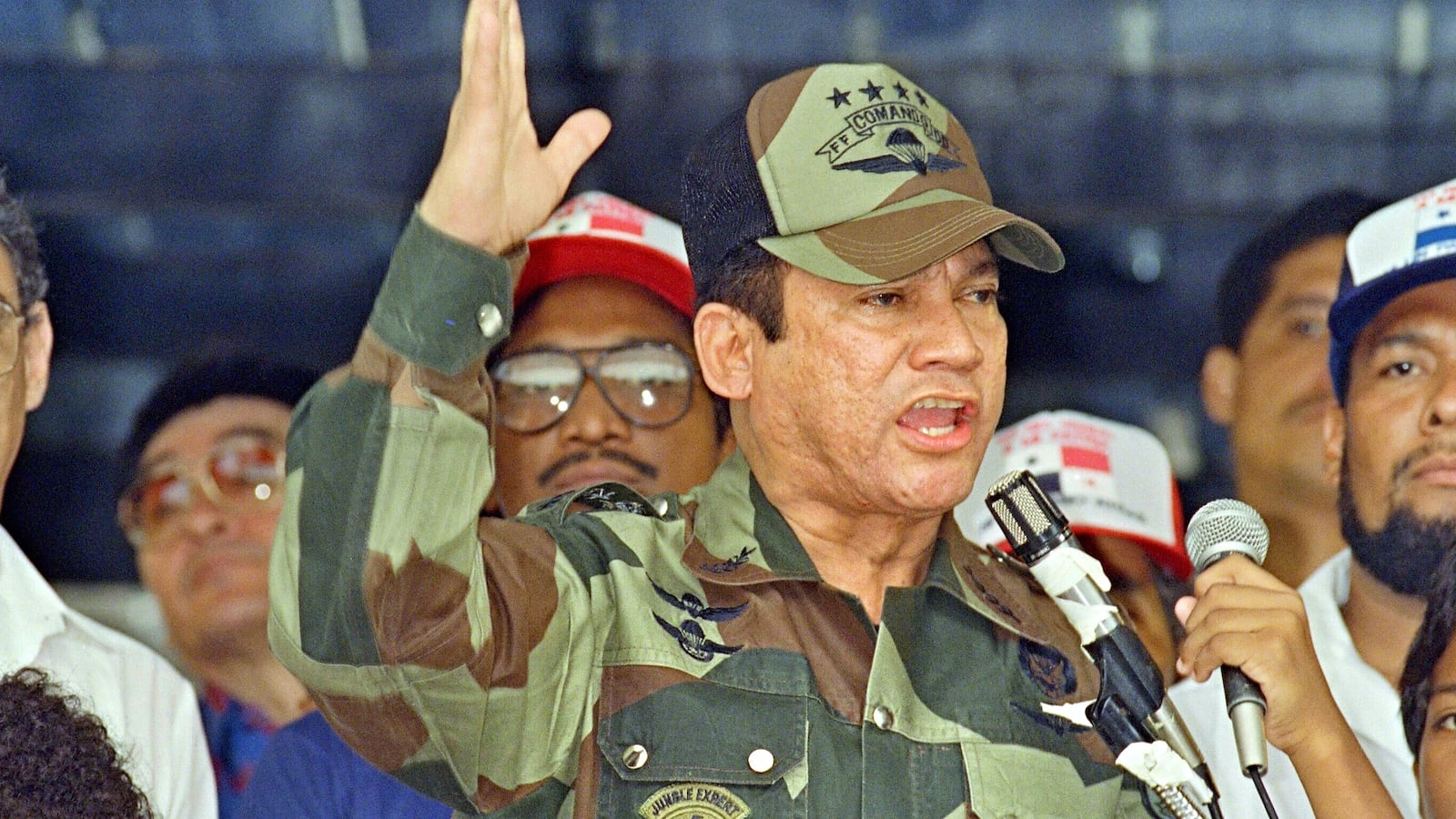 General Manuel Antonio Noriega speaks 20 May 1988 in Panama City during the presentation of colors to the San Miguel Arcangel de San Miguelito volunteer batallion. Noriega said that discussions with the U.S. could not continue as long as the U.S. continued its agression and that Panamian democracy will not follow an North American schedule. (Photo credit should read ANGEL MURILLO/AFP via Getty Images)