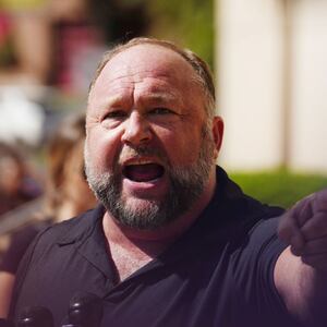InfoWars founder Alex Jones speaks to the media outside Waterbury Superior Court during his trial on September 21, 2022 in Waterbury, Connecticut. Jones is being sued by several victims' families for causing emotional and psychological harm after they lost their children in the Sandy Hook massacre. A Texas jury last month ordered Jones to pay $49.3 million to the parents of 6-year-old Jesse Lewis, one of 26 students and teachers killed in the shooting in Newtown, Connecticut. (Photo by Joe Buglewicz/Getty Images)