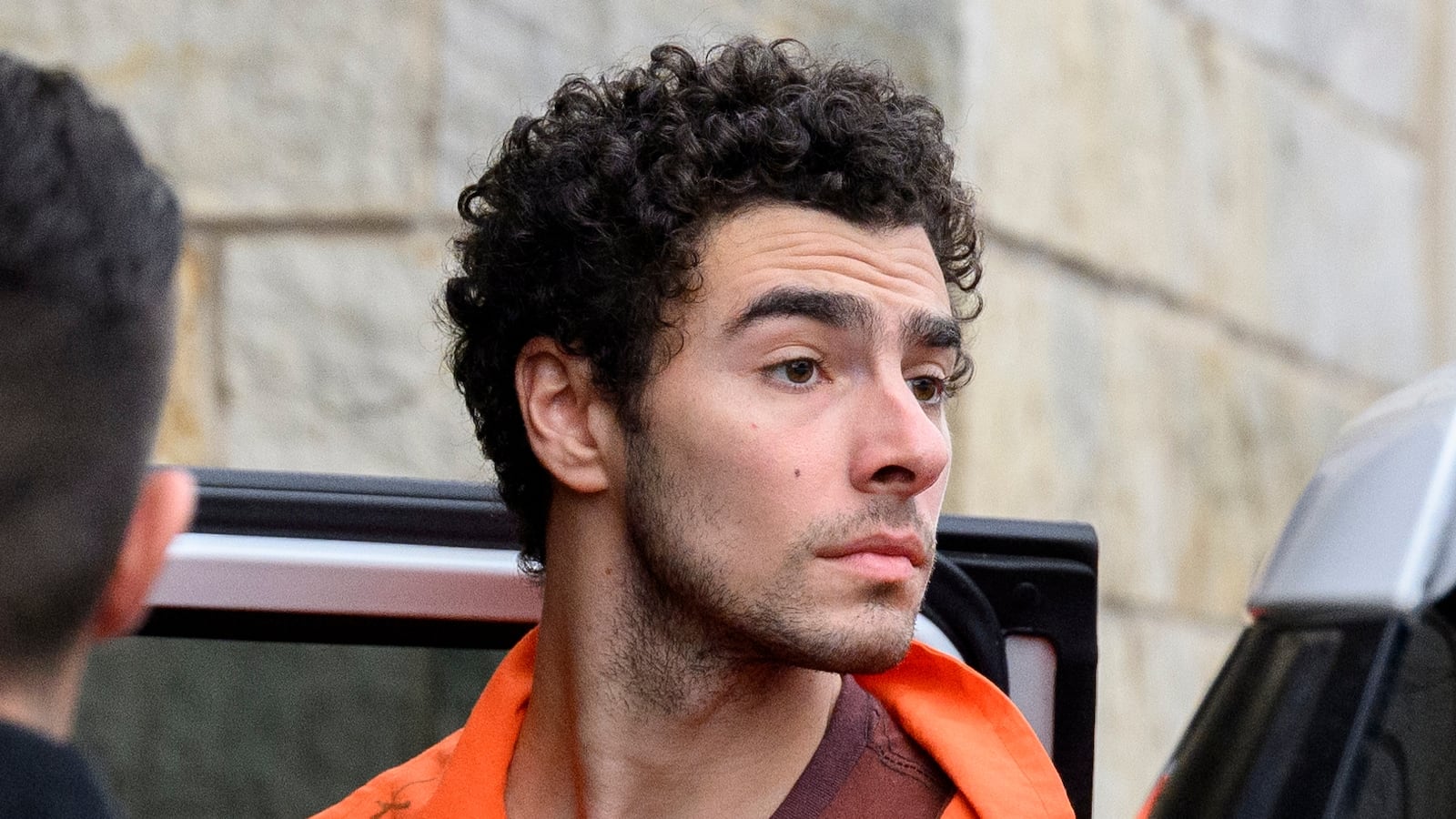 HOLLIDAYSBURG, PENNSYLVANIA - DECEMBER 10: Suspected shooter Luigi Mangione is led into the Blair County Courthouse for an extradition hearing December 10, 2024 in Hollidaysburg, Pennsylvania. Mangione has been arraigned on weapons and false identification charges related to the fatal shooting of United Healthcare CEO Brian Thompson in New York City. Mangione is incarcerated in the State Correctional Institution in Huntingdon, Pennsylvania awaiting extradition to New York. (Photo by Jeff Swensen/Getty Images)