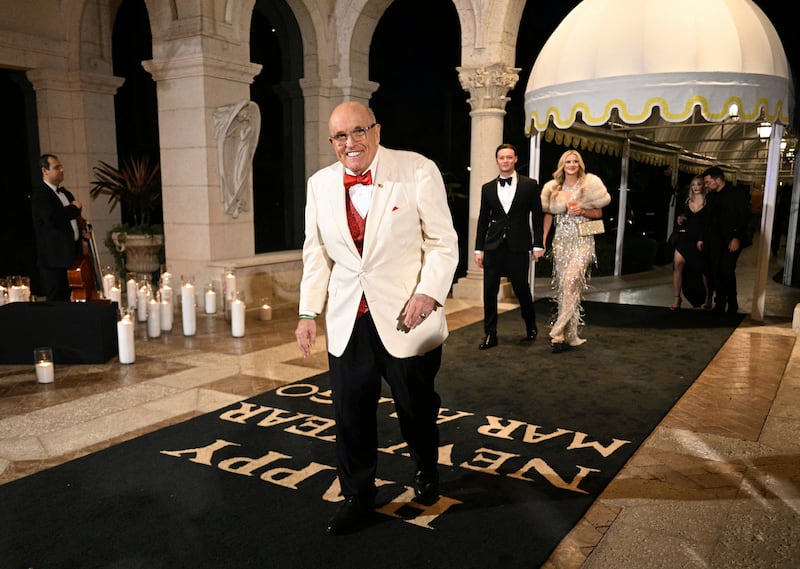 Rudy Giuliani arrives at Donald and Melania's New Year's Eve party at Mar-a-Lago.