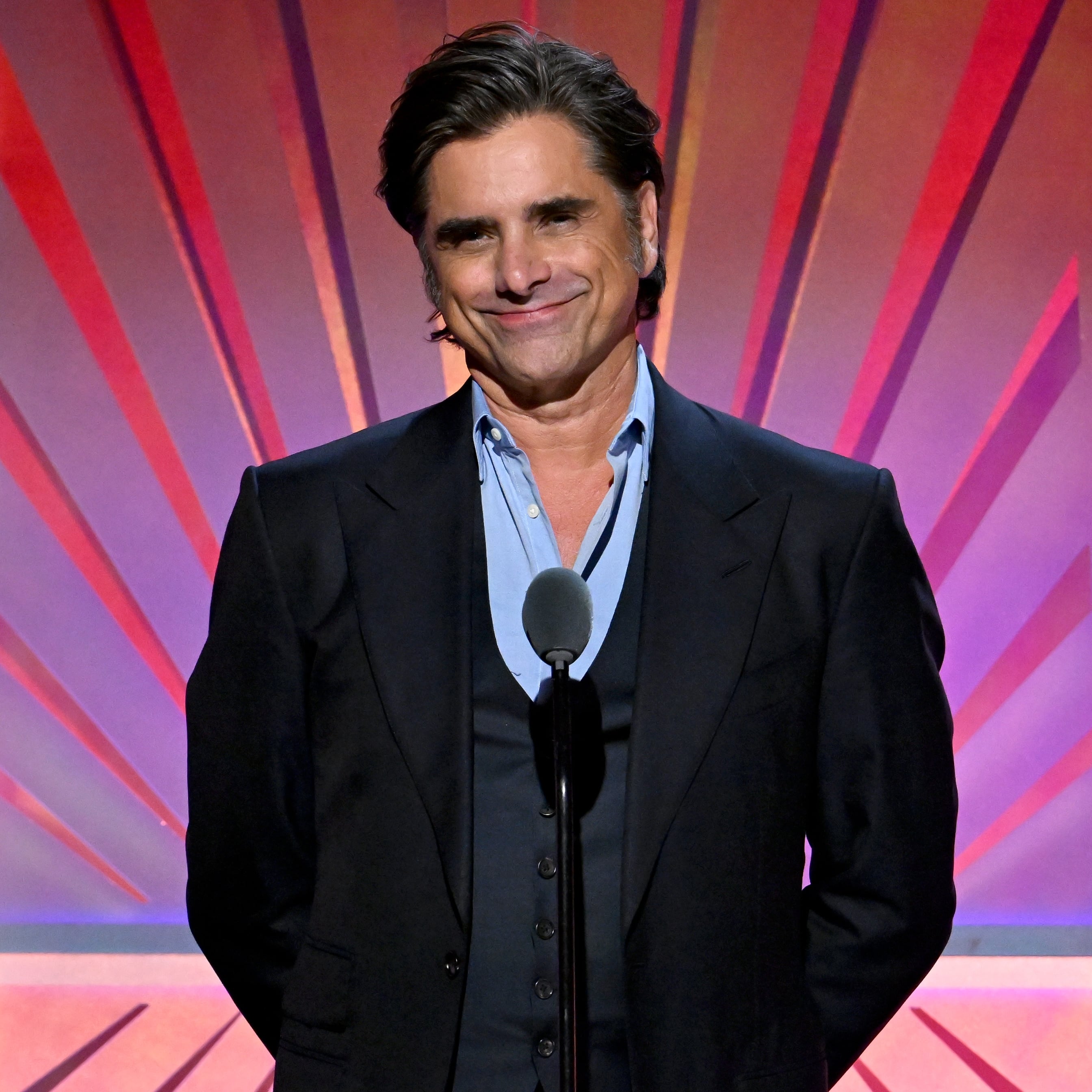 John Stamos speaks onstage during AARP's Annual Movies For Grownups Awards at the Beverly Wilshire, A Four Seasons Hotel on February 08, 2025 in Beverly Hills, California.