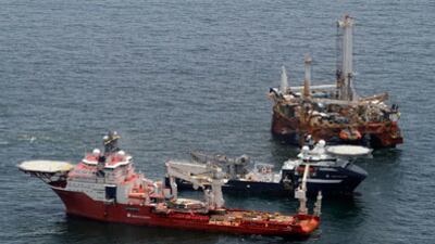 cheats/2010/07/18/tests-show-no-damage-to-well/oil-cap_llitjw