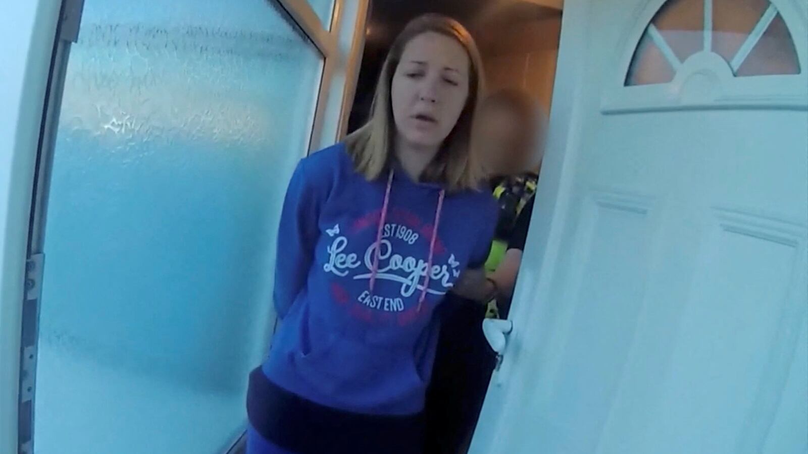 Lucy Letby being taken in custody by police, in Chester, Britain, in this screengrab obtained from an undated Handout video obtained by Reuters on Aug. 17, 2023.