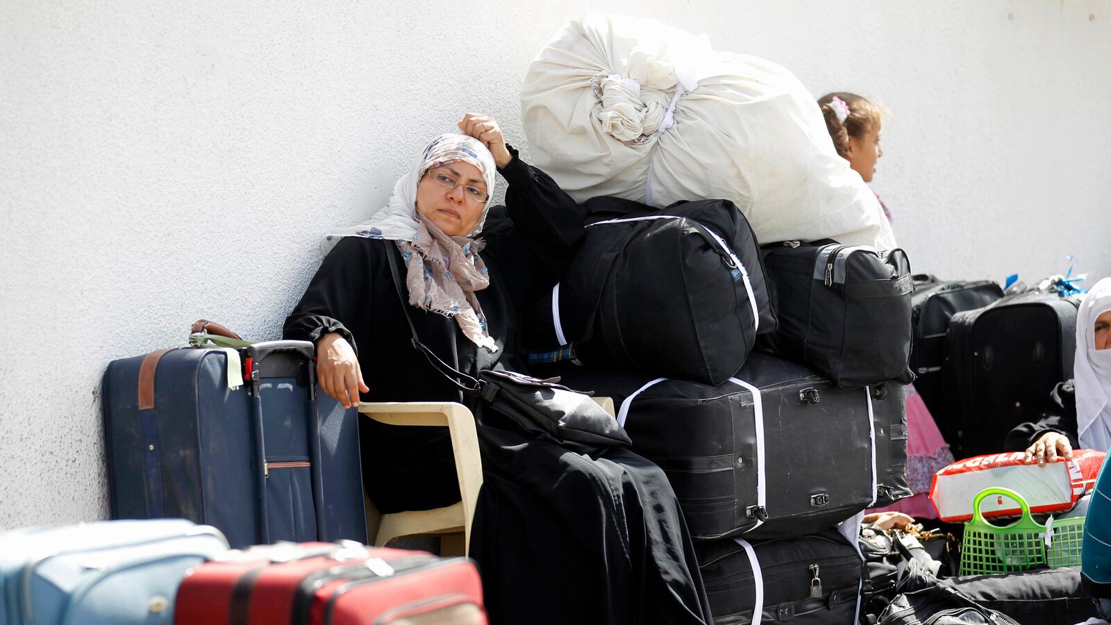 articles/2013/09/26/imprisonment-of-two-canadian-activists-illustrates-egyptian-regime-s-growing-repression/OZ_Rafah_crossing_a7pzpc