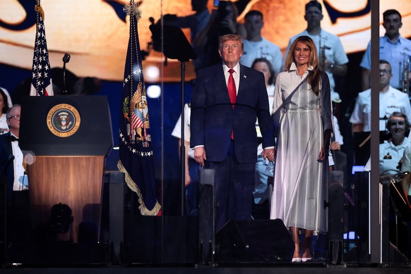 U.S. President Donald Trump and first lady Melania Trump attend a Fourth of July rally, marking the 250th anniversary of U.S. independence, on the National Mall in Washington, D.C., U.S., July 4, 2026. REUTERS/Evan Vucci