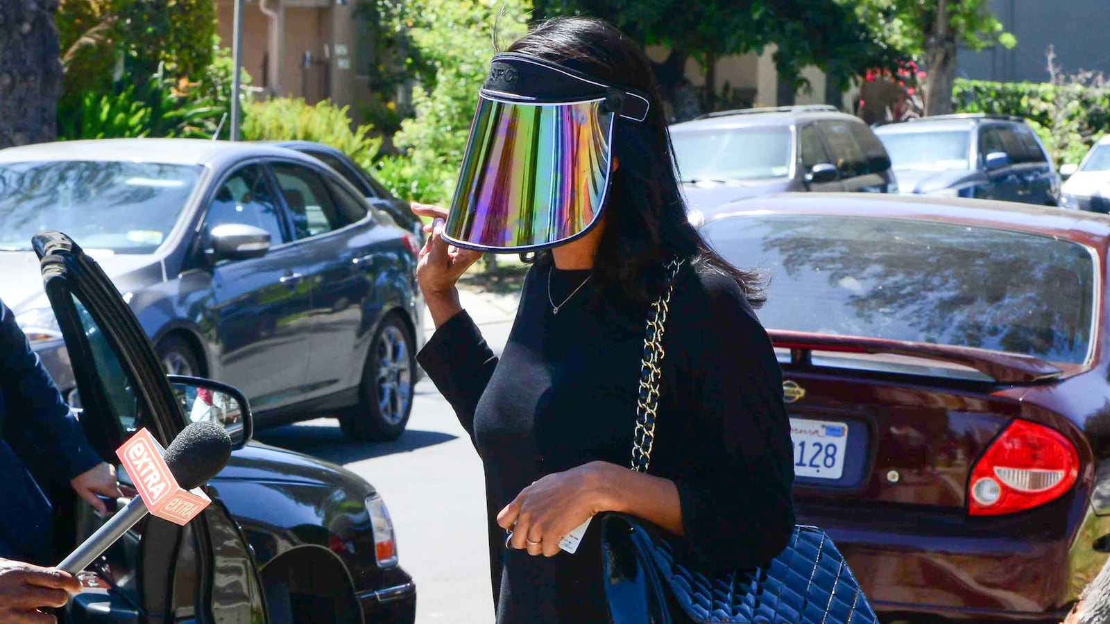 articles/2014/05/05/donald-sterling-s-former-mistress-makes-the-paparazzi-shield-chic-cara-delevingne-has-self-grooming-eyebrows/140505-stiviano-fashion-cheat_wl57wj