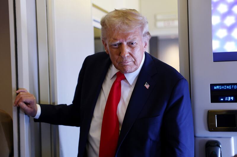 President Donald Trump speaks to reporters on Air Force One on September 18, 2025.