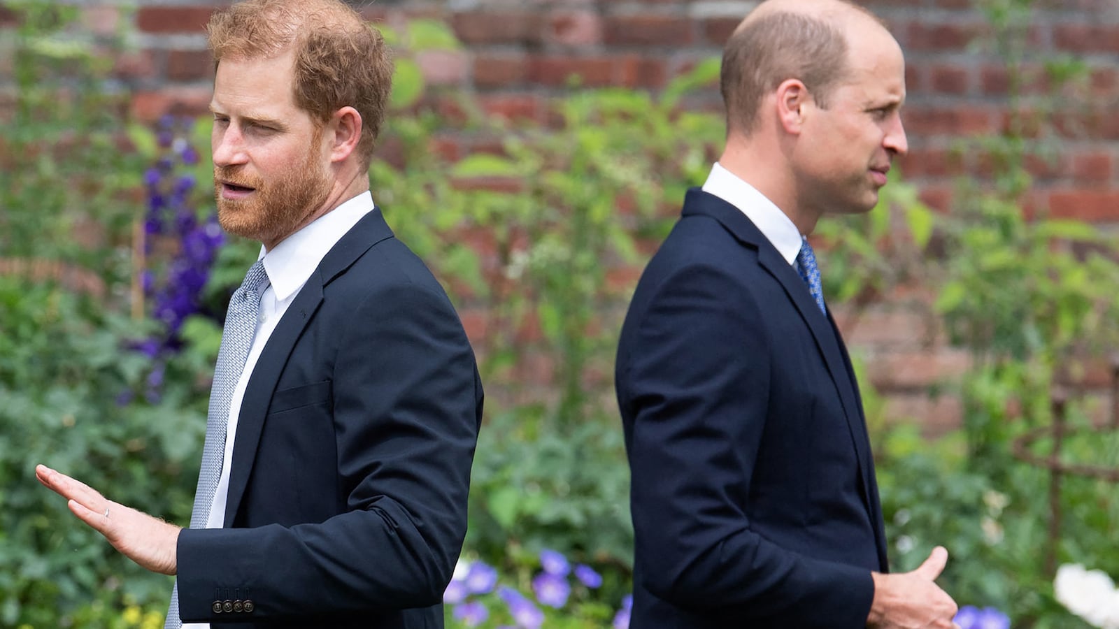 TOPSHOT - Britain's Prince Harry, Duke of Sussex (L) and Britain's Prince William, Duke of Cambridge attend the unveiling of a statue of their mother, Princess Diana at The Sunken Garden in Kensington Palace, London on July 1, 2021, which would have been her 60th birthday. Princes William and Harry set aside their differences on Thursday to unveil a new statue of their mother, Princess Diana, on what would have been her 60th birthday.