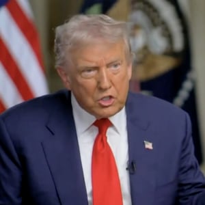 Trump brandishes his list of "resolved" conflicts.