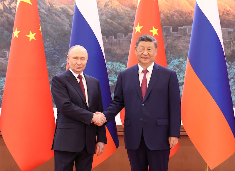 Chinese President Xi Jinping and Russian President Vladimir Putin shake hands before a meeting at the Great Hall of the People in Beijing, China May 20, 2026.