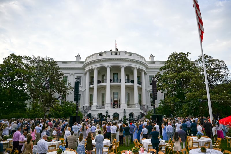 Attendees listen to US President Donald Trump and First Lady Melania Trump during the Congressional Picnic on the South Lawn of the White House in Washington, DC on May 19, 2026.