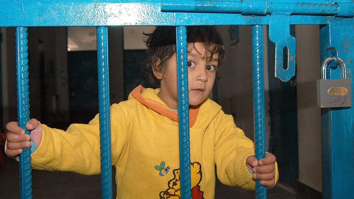 articles/2011/12/03/babies-behind-bars/afghan-women-babies-behind-bars-boy_mxb1df