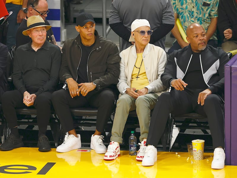 David Geffen, Donovan Michaels, Jimmy Iovine and Dr. Dre sit court side at a Los Angeles Lakers game in 2023.