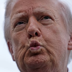 Donald Trump puckering his lips.