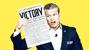 Pete Hegseth holding a World War 2 newspaper.