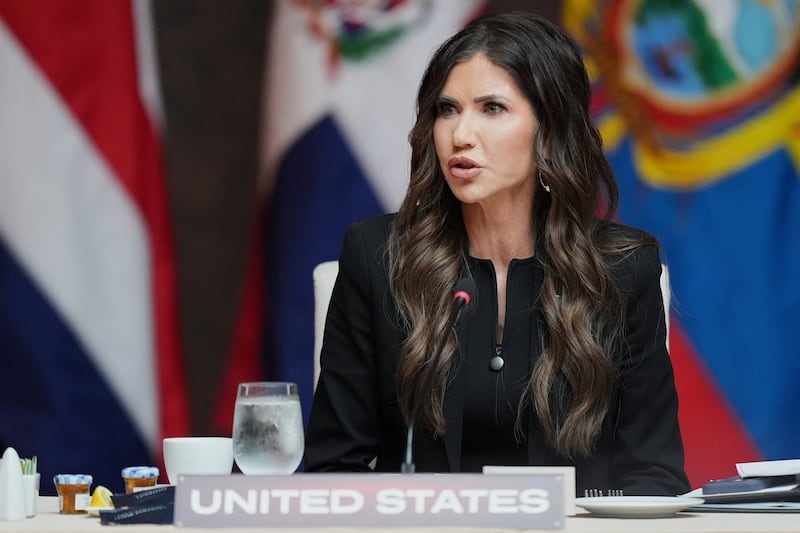 Kristi Noem delivers remarks at a working lunch at the Shield of the Americas Summit at Trump National Doral Miami, in Doral, Florida, U.S., March 7, 2026.