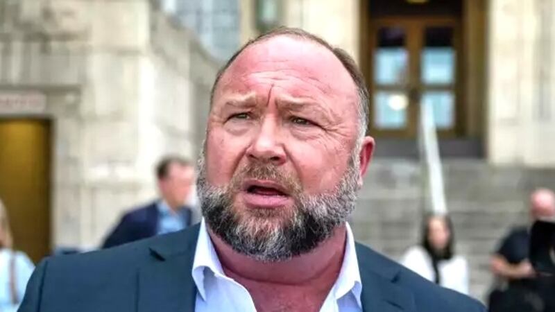 Alex Jones speaks to the media