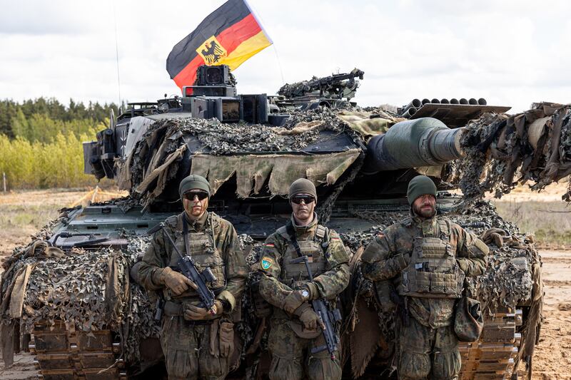 RUKLA, LITHUANIA - MAY 16: German soldiers in front of tank during Iron Wolf military exercises with NATO forces and partners on May 16, 2025 at the Gaiziunai training area near Rukla, Lithuania. The exercise culminated in an airborne assault operation executed by the United States 173rd Air Assault Brigade. (Photo by Paulius Peleckis/Getty Images)