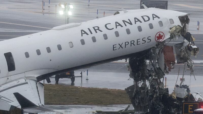 An Air Canada Express CRJ-900 sits on the runway after colliding with a Port Authority fire truck at LaGuardia Airport in New York, on March 23, 2026.